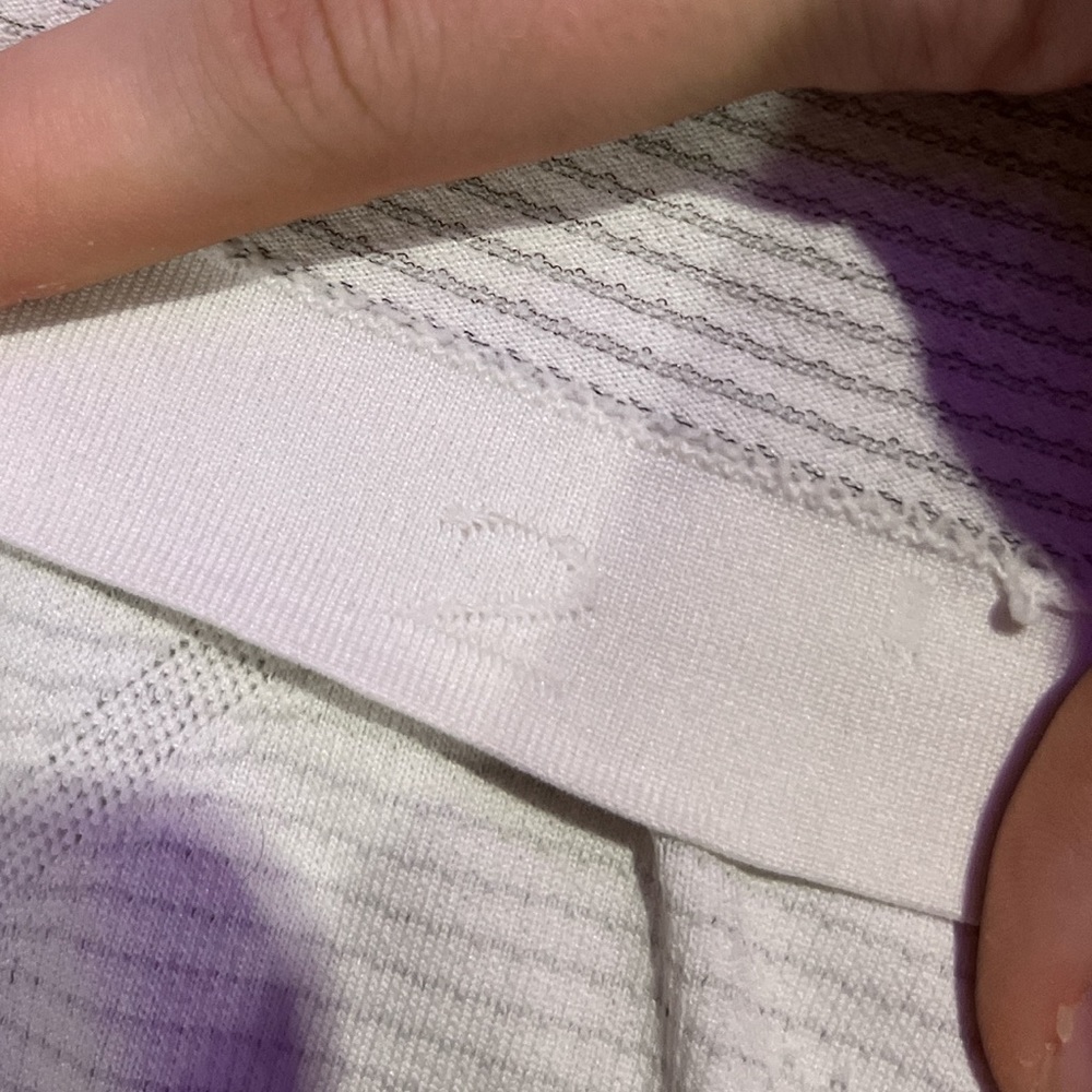 White lululemon swiftly tech! One small stain but you can see it when it’s on 🥰